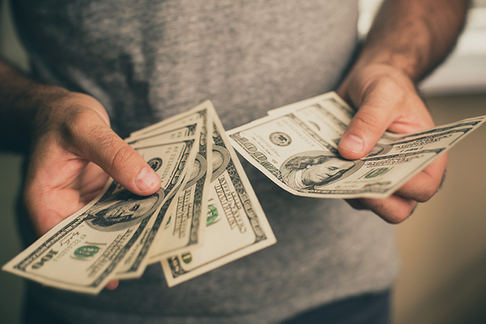 Man holding cash